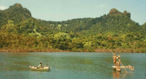 Jana poling a bamboo raft, Matuku.